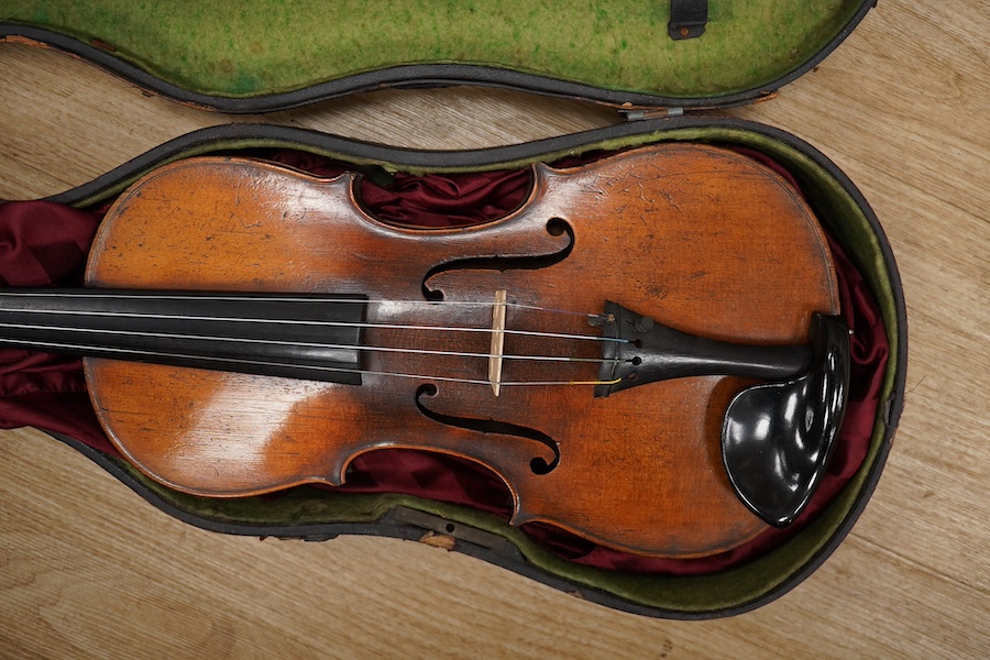 A late 19th century German violin from the Mittenwald region, body length 36cm, in a contemporary case. Condition - fair to good, condition of the case - poor.